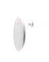 White circular kitchen scale by Alessi, with ridged sides and a small oval indentation, next to a white cylindrical wall mount.
