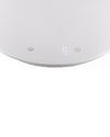 White digital kitchen scale by Alessi, displaying '0 g', with 'U' and 'I' symbols on a round, smooth surface, top-down view.