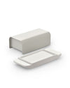 Matte light grey butter dish by Alessi, featuring a rectangular base and a detached U-shaped cover.