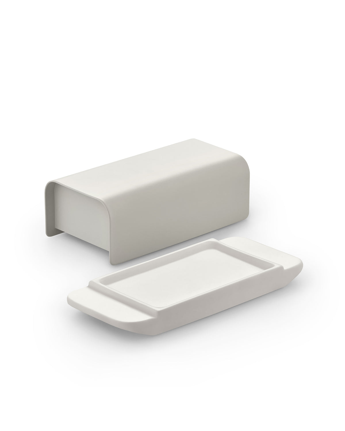 Matte light grey butter dish by Alessi, featuring a rectangular base and a detached U-shaped cover.